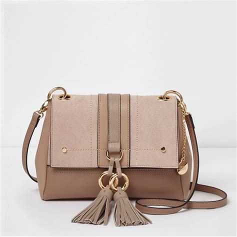 beige cross body purse.